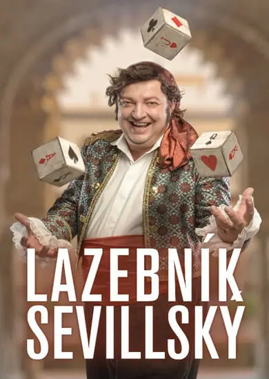 Plakát inscenace Lazebník sevillský Městského divadla Brno: usměvavý Figaro v pestré vestě a kolem něj létají hrací kostky. KULTINO*